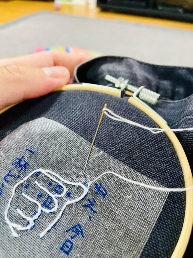 男の手縫い刺繍